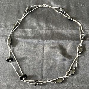 Long silver chain with black beads.  58-60in strand.